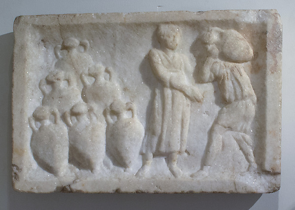 A Roman marble relief with raised carved figures and large amphora jars.